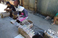 production miniature guitar in sanding wood step