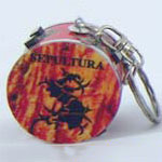 Keyring Drum Sepultura, burning Sepultura logo