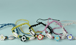 Bali Boho mecrame brecelet made of lether and resin flower ornament, wholesale in mix color cheap price