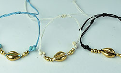 handmade bracelet gold shell plate charms in double line braided cord, handmade bracelet form Bali Indonesia